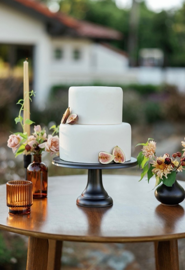 Autumn Romance wedding design — rich floral centerpiece of crimson and amber blooms on harvest table, image 4 of 9 — Lux Events by Michelle