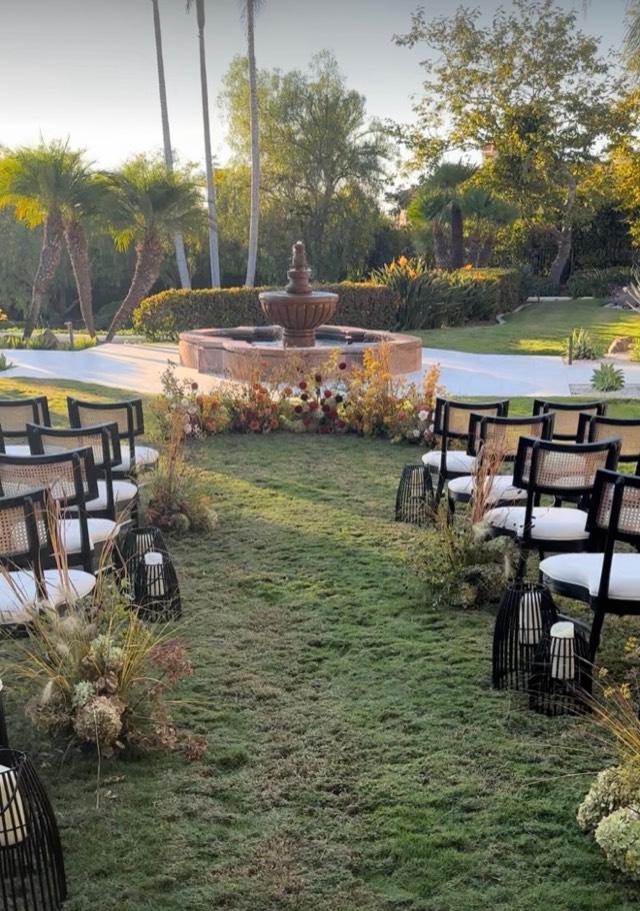 Autumn Romance wedding florals — aisle lined with lush rust and burgundy dahlia arrangements in warm candlelight, image 7 of 9 — Lux Events by Michelle