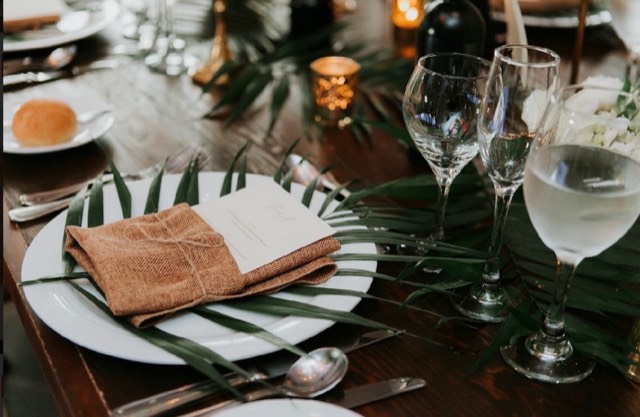 Coastal Celebrations tablescape — outdoor reception with tropical foliage and glowing candelabras, image 3 of 7 — Lux Events by Michelle