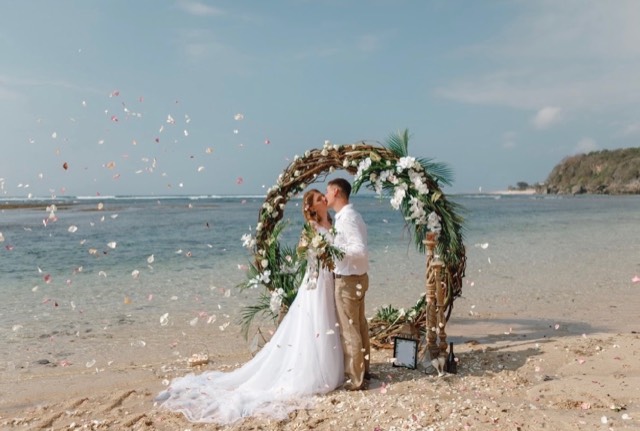 Coastal Celebrations event design — palm frond and tropical floral arrangements along a candlelit reception table, image 5 of 7 — Lux Events by Michelle