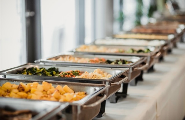 Coastal Celebrations catering reception — warm, candlelit indoor dining setup — Lux Events by Michelle