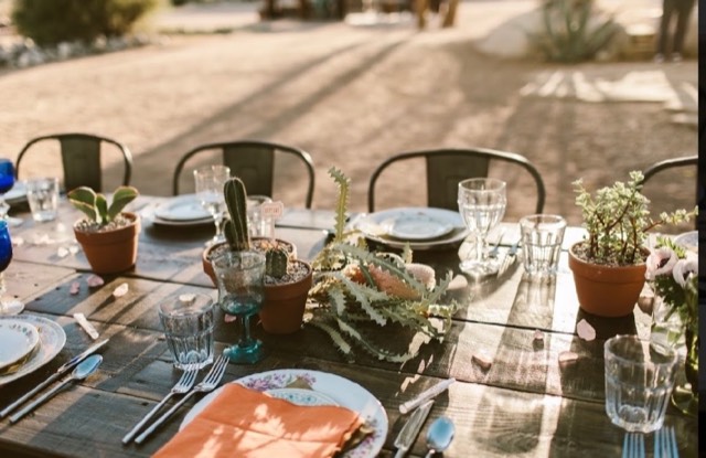 Desert Reverie wedding — outdoor ceremony in the golden desert landscape with natural stone backdrop, image 2 of 10 — Lux Events by Michelle