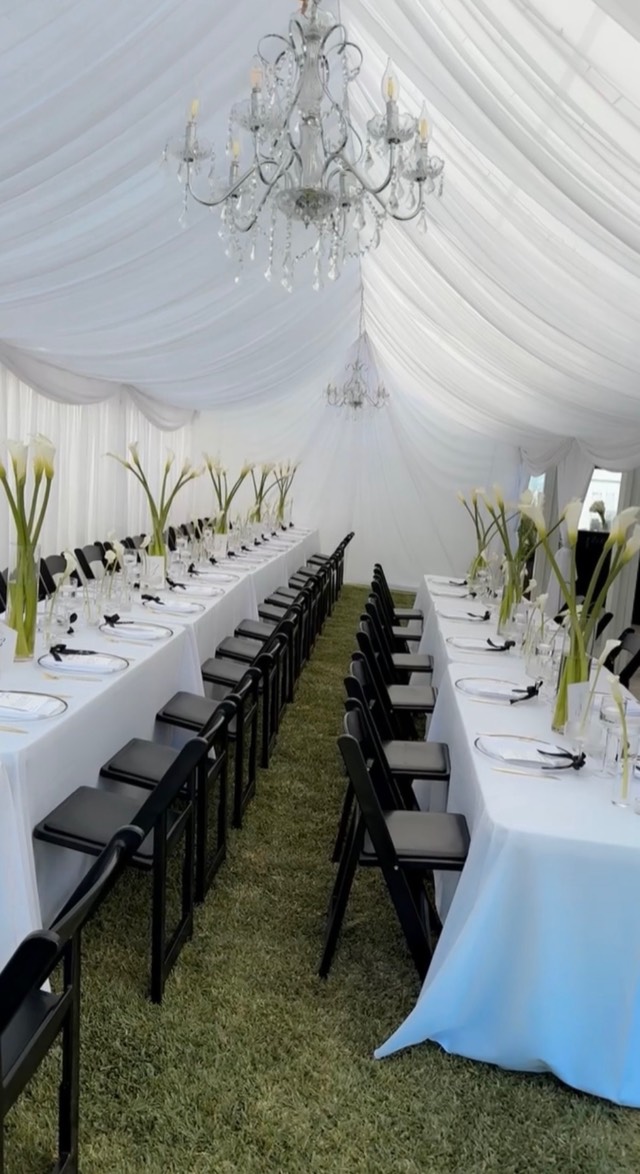 Minimalist luxury wedding ceremony — draped venue with white floral arch and structured arrangements, image 13 of 14 — Lux Events by Michelle